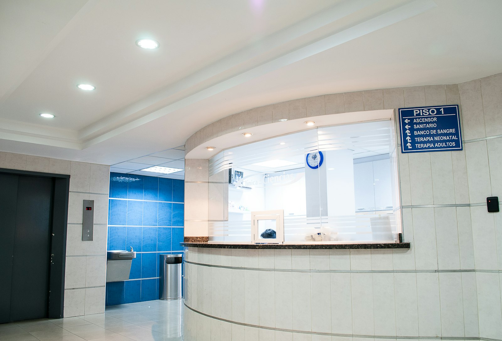 Senior clinician in a hospital corridor
