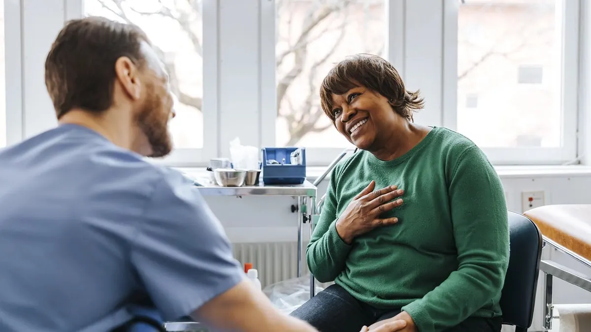 A community clinician and patient in warm conversation
