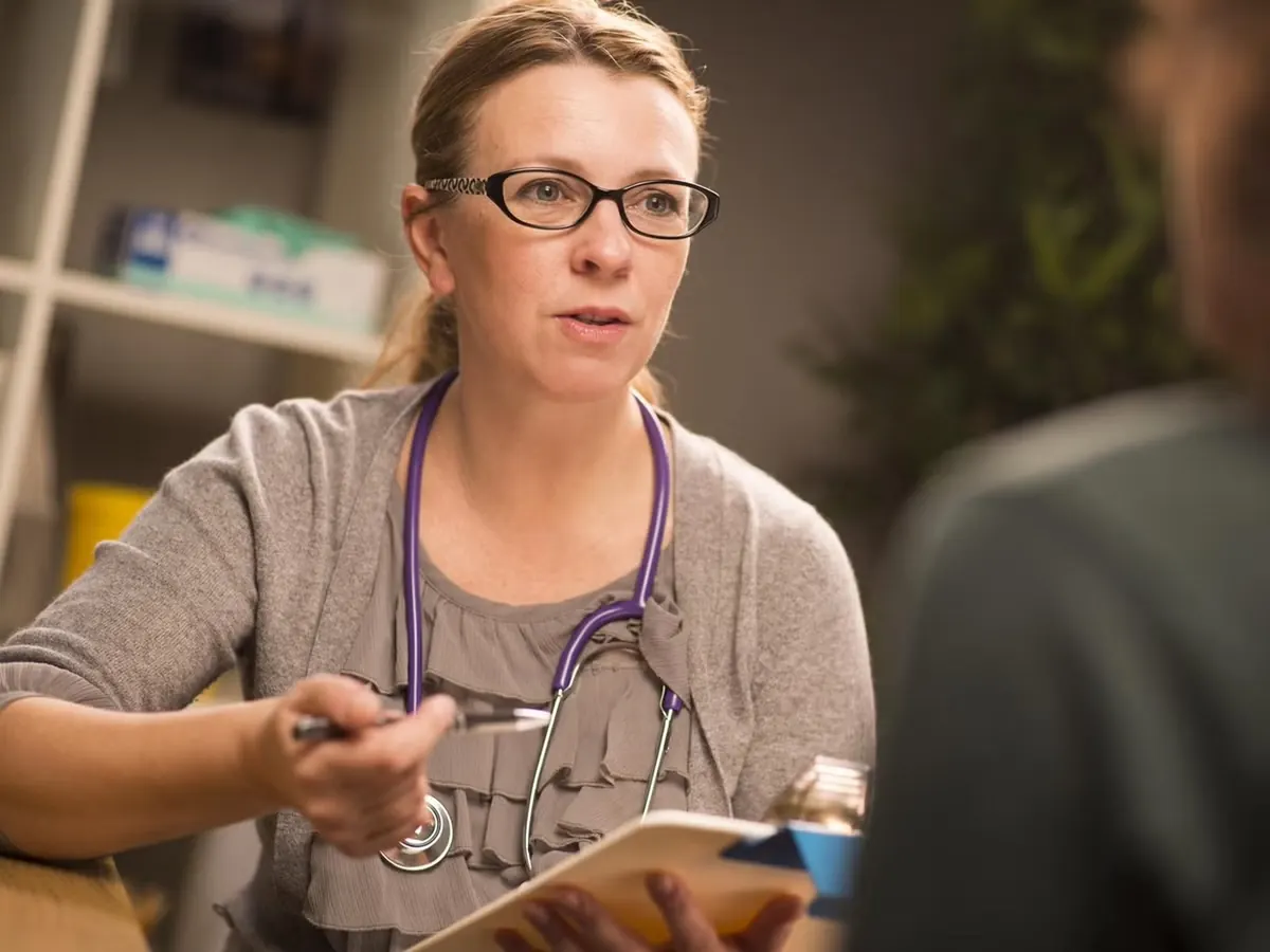 A clinician discussing a care plan with a patient