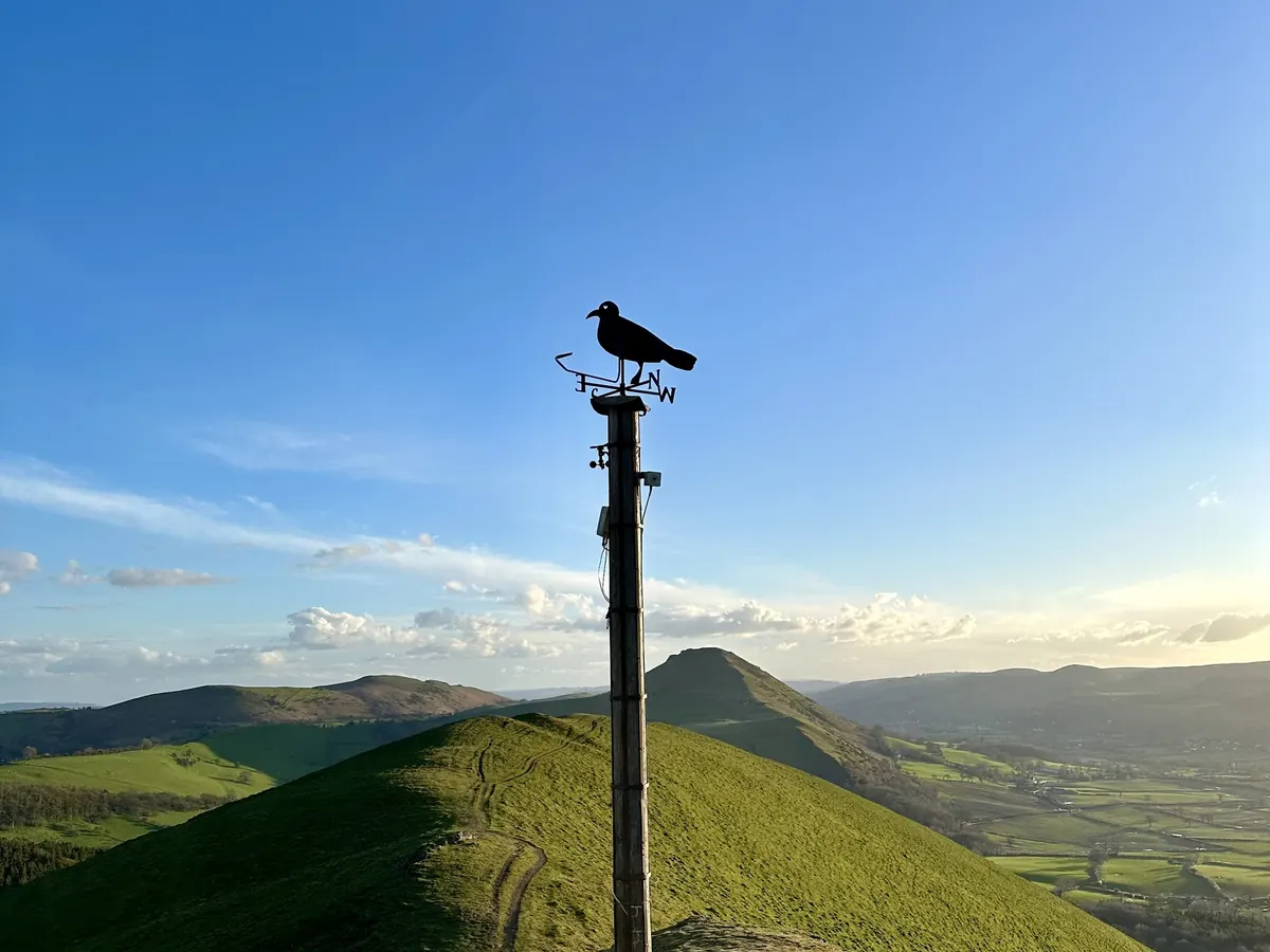 The Shropshire hills above the Lawley, with a weathervane on the summit ridge
