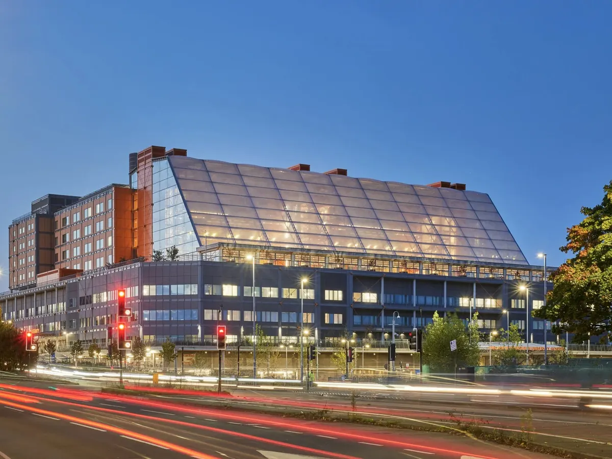 A modern NHS hospital at dusk